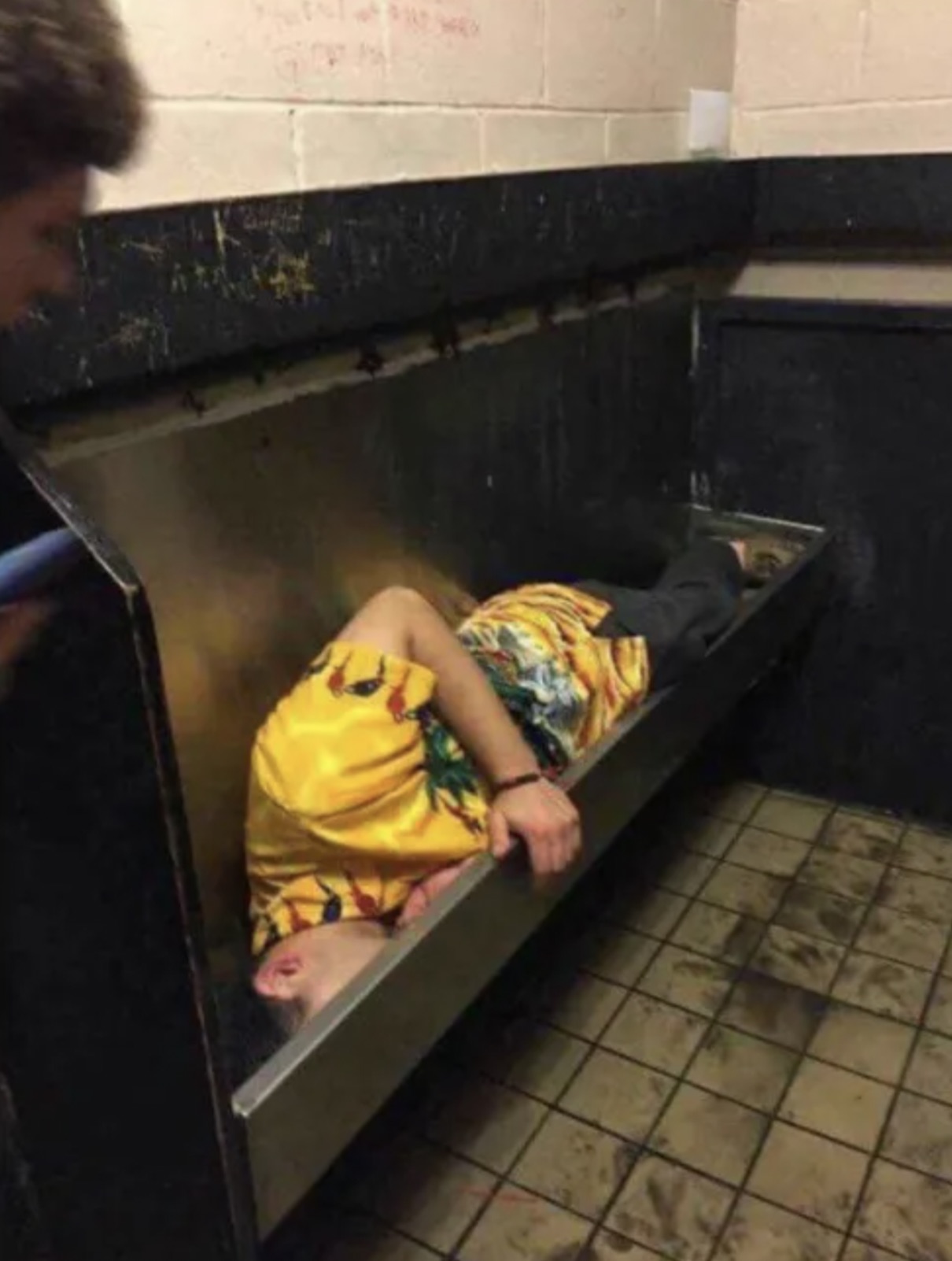 passed out in urinal